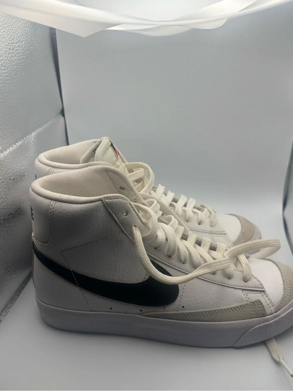 Nike Women's White High-Top Sneakers with Black Swoosh